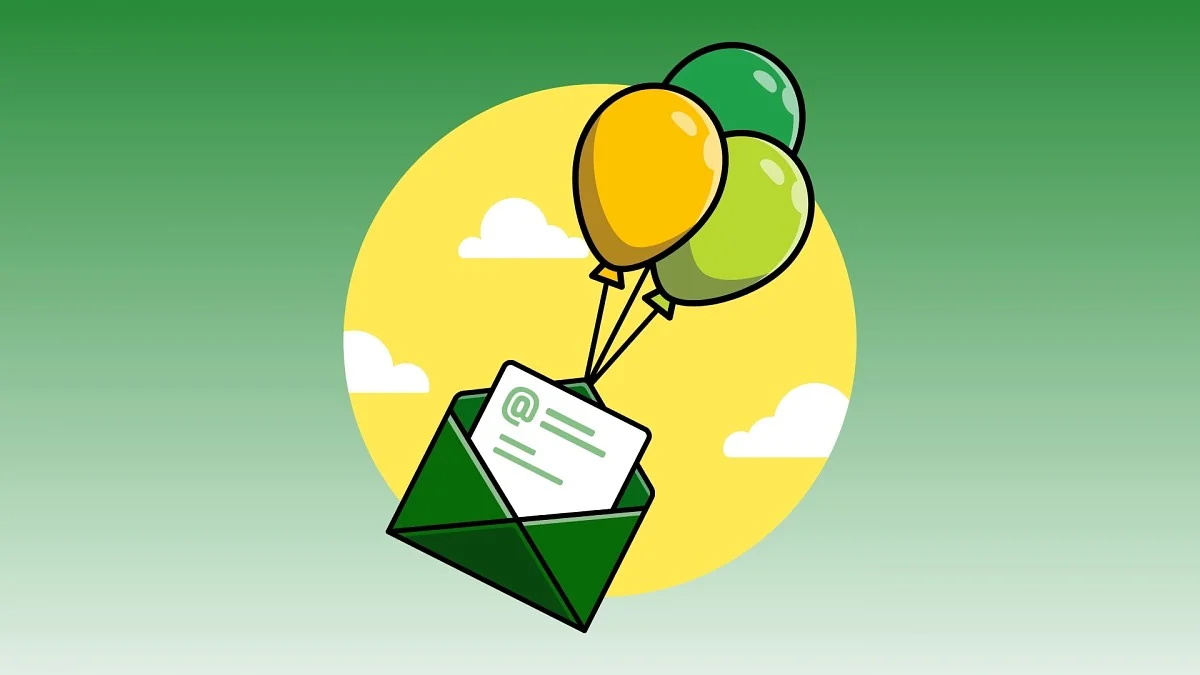 Green and yellow balloons carrying green envelope symbolizing email